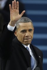 President Barack Obama waves after his inauguration speech in Washington, Monday, Jan. 21, 2013.