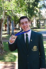 From Mansfield to Brazil: Tim Hume with his silver medal won at the Earth Science Olympiad.