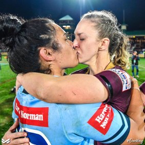 Questions of consent and strategy: Karina Brown and Vanessa Foliaki kiss at the end of the inaugural women's State of Origin match. 