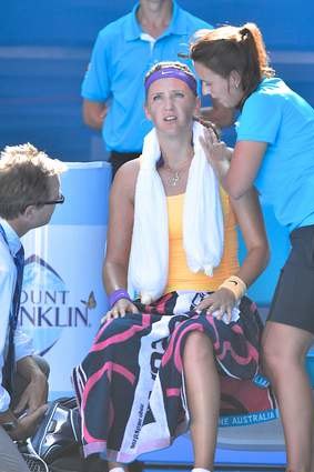 Victoria Azarenka is treated after losing a game in which she had five match points. Shortly after, she left court for two medical time-outs lasting ten minutes.