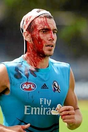 Jonathon Ceglar came off worse for wear in a clash with Darren Jolly at Collingwood training during the 2012 season.