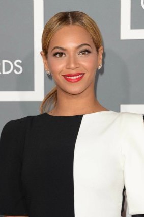 Beyonce let her bootylicious body do the talking and jumped on the red carpet in a monochrome onesie.