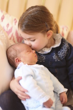 Princess Charlotte cuddles her brother Prince Louis. 