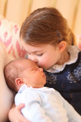 Princess Charlotte cuddles her brother Prince Louis. 