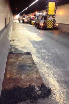 The clean up after a fuel spill in the Harbour Tunnel on Thursday.