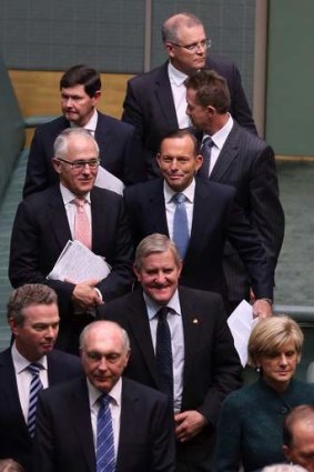 Prime Minister Tony Abbott with his ministers after a condolence motion for former prime minister Gough Whitlam on Tuesday.