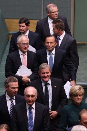 Prime Minister Tony Abbott with his ministers after a condolence motion for former prime minister Gough Whitlam on Tuesday.