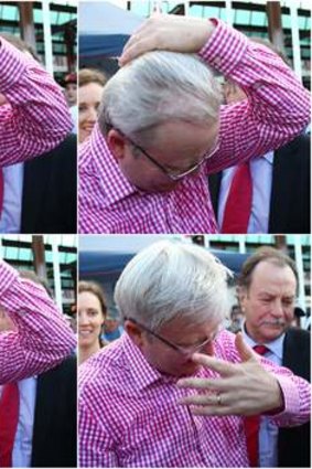Prime Minister Kevin Rudd adjusts his hair after preparing starwberry sundaes at the EKKA Brisbane Show on Wednesday.