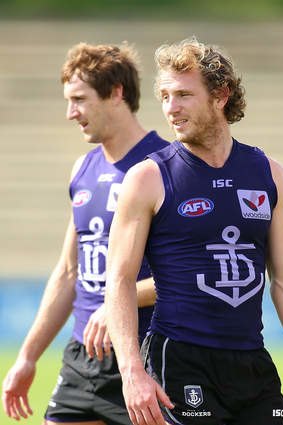 Michael Barlow and David Mundy look on during a Fremantle Dockers AFL training session.