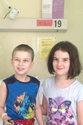 Harrison with his older sister Ella, who was the perfect donor match.