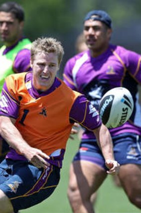 Storm boy ... Brett Finch passes the ball during a Melbourne Storm NRL training session at Gosch's Paddock today.
