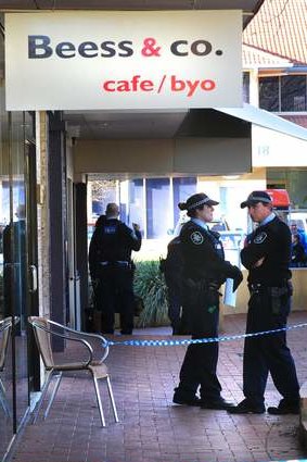 Police attend the scene of an armed robbery at Yarralumla shops.