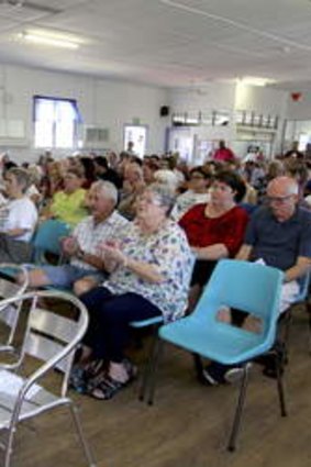 Redcliffe residents listen to candidates speak ahead of next week's state byelection.