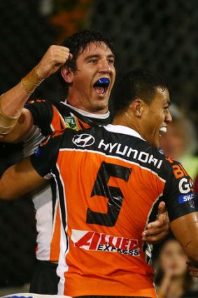 Drought broken: Joel Reddy celebrates his first try of the season with winger Tim Simona.