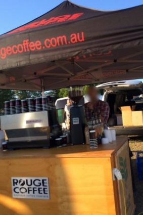 A Rouge Coffee tent is searched by police on Friday as part of Operation Juliet Wave.