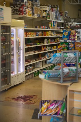 Blood on the floor of the store after the fatal shooting.