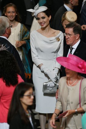 Channeling Meghan? Angelina Jolie attends a service marking the 200th anniversary of the Most Distinguished Order of St Michael and St George, at St. Paul's Cathedral in London. 