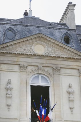 The French flag flies at half mast at the Elysee palace in Paris.