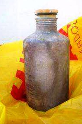 One of the toxic cannisters that has washed up on Queensland beaches.