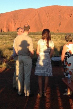 The royal couple preparing to watch the sun set over Uluru.