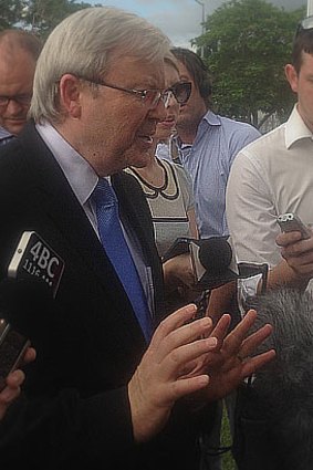 Kevin Rudd answers questions from journalists during a press conference in Brisbane.