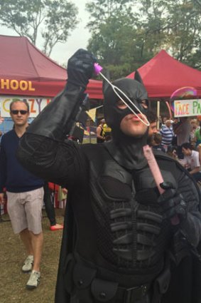 Batman blows bubbles at the Red Hill Fair.