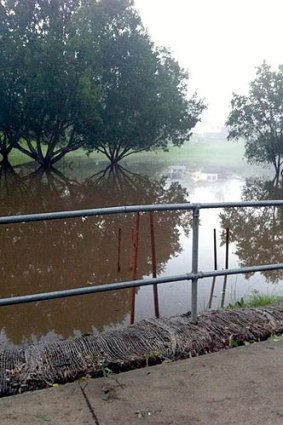 Flood waters rise at Jindalee.