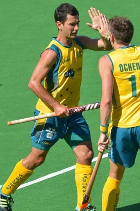 Jamie Dwyer of Australia (L) is congratulated by team mate Eddie Ockenden (R) after scoring against India.