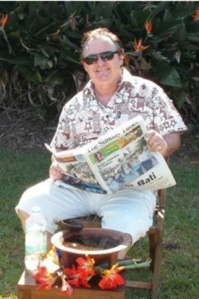 In this image supplied by Peter Foster, the conman is seen reading the Fiji Sunday Times newspaper with what he claims is a bowl of kava in front of him. Foster supplied this image after being challenged by Fairfax Media to prove he was actually in Fiji.