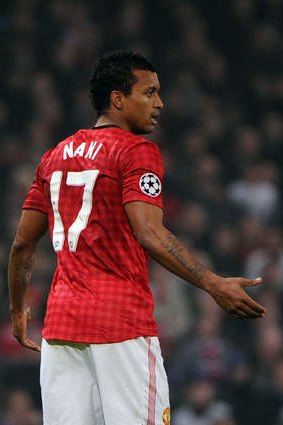 Manchester United's Portuguese midfielder Nani reacts to being sent off during the UEFA Champions League round of 16 second leg football match between Manchester United and Real Madrid at Old Trafford in Manchester. Real Madrid won 2-1 (3-2 on aggregate). AFP PHOTO / PIERRE-PHILIPPE MARCOU