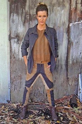 Cordelia Gibbs wearing her submission of trousers inspired by shearing pants and a jacket which nods to the iconic Driza-Bone.