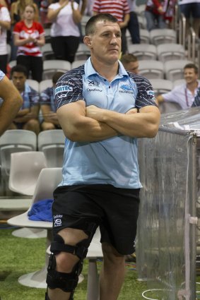 Gallen stands with his knee in a brace after being forced from the field.