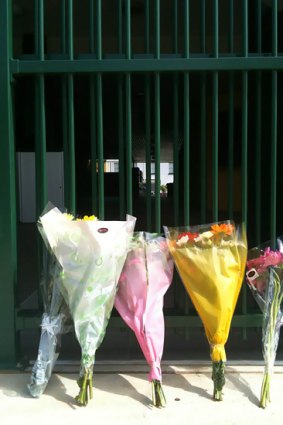 Flowers placed outside the gate at St Patrick's College, Brisbane, where Elliot Fletcher, 12, was killed.
