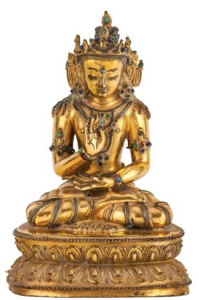 Record prices &#8230; a Tibetan gilt-bronze silver inlaid and jewelled figure of Amogahasidi.