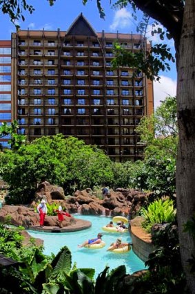 No danger with Disney ... lifeguards oversee guests floating a lazy river through a man-made rock garden at Disney's resort.