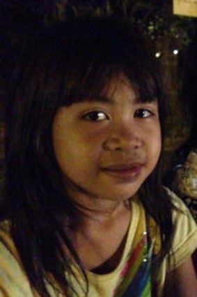 Lisa, 6, and Risa, 7, are forced to beg on the streets of Kuta.