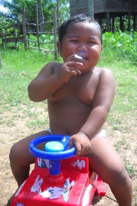 Two-year-old Indonesian boy Ardi Rizal puffs on a cigarette.
