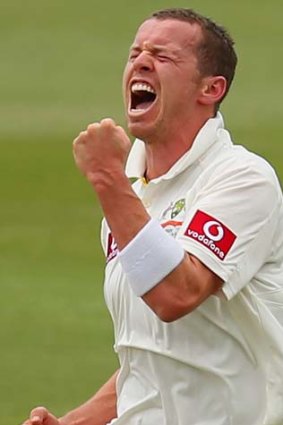 On top; Peter Siddle takes A.B. de Villiers' wicket.