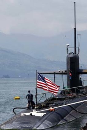Anti-US crusader Father Shay Cullen, and a US submarine in Subic Bay.