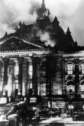 The Reichstag in flames during the Nazi ascent to power in Berlin.