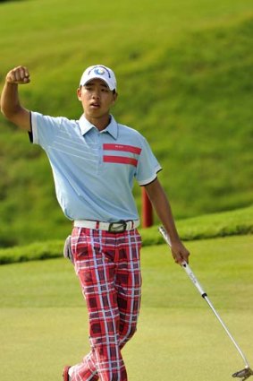 No guts, no glory &#8230; Guan Tianlang wins the Asia-Pacific Amateur title with a ''belly'' putter.