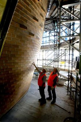 Father and son: Peter and Ray Favetti with part of the completed angled wall.