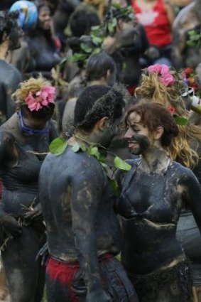Mud-covered revellers dance during the Bloco da Lama or 'mud street partyÃ?Â?' in Paraty, Brazil.