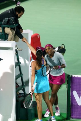 Serena Williams and Jelena Jankovic exchange words after their match.