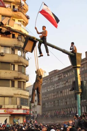 A protester hangs an effigy representing Egypt's military ruler at Tahrir Square.