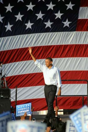 Popularity down: President Barack Obama attends a rally in Philadelphia as part of his campaign to get Democrats to vote in next month's mid-term elections.