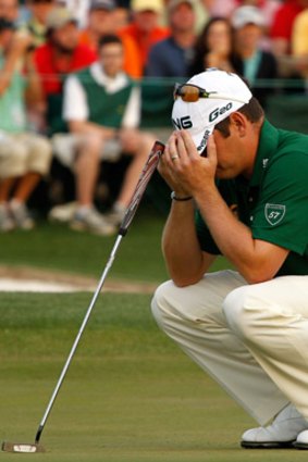 Anguish: Oosthuizen reacts after a putt on the 18th hole during the final round.