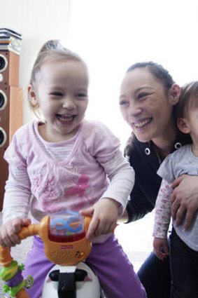 'I want to train myself up to get a good job. I can't rely on the government to... look after my kids.' Sharlie Liew, with daughters Sharmia, 2, and Laura-Joan, 1.