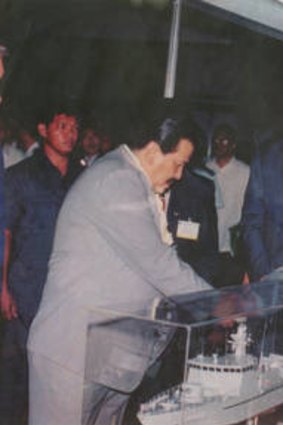 Former Philippines president Joseph Estrada (left) greets Tenix executives.