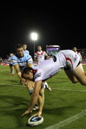 Wonder try: Brett Morris finds a way to avoid the sideline with this acrobatic putdown against the Cronulla Sharks.